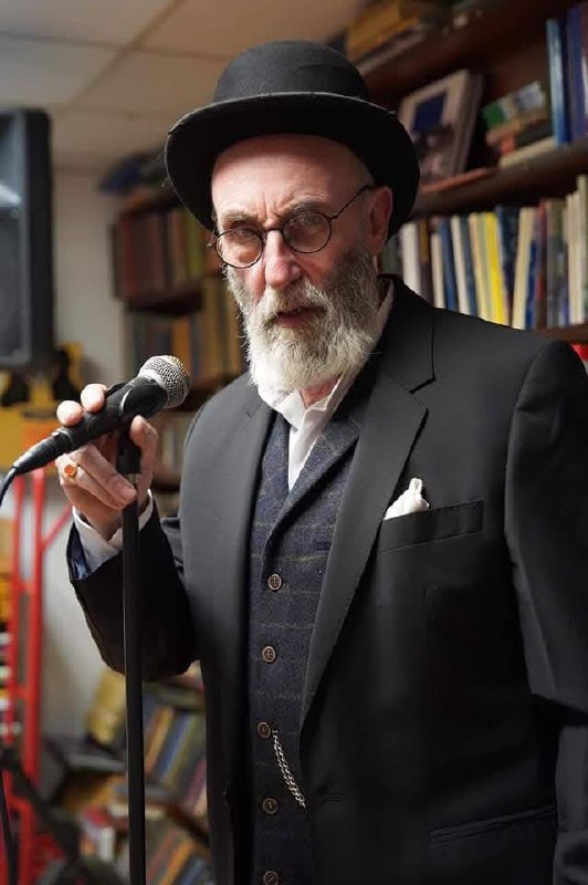 At the microphone