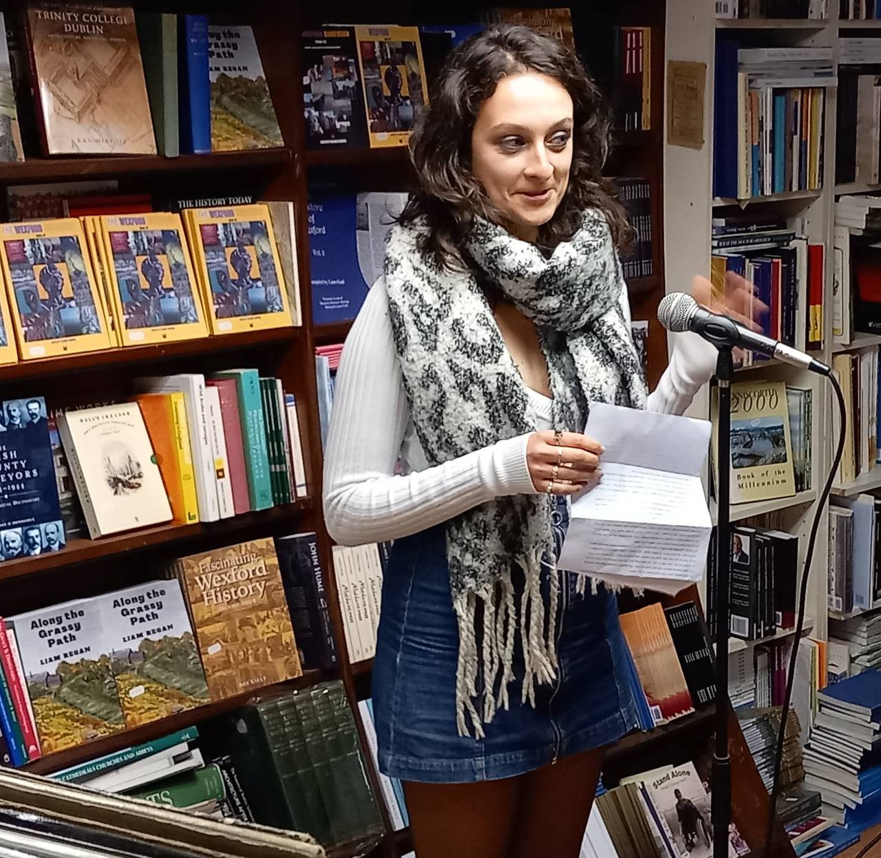 A reading, in front of the Wexford history shelf